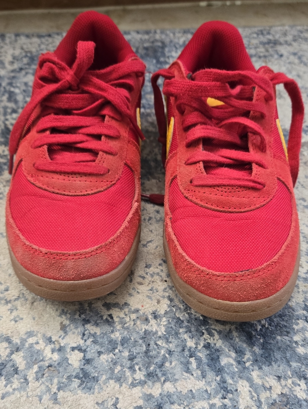 Nike Kids Red Sneakers with Yellow Swoosh